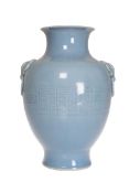 A CHINESE CELADON VASE, with pale blue ground, moulded with "elephant" ring handles and Greek Key,
