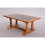 A FISHMAN OAK AND MARBLE-INSET COFFEE TABLE, rectangular, with trestle base,