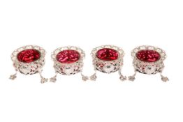 A SET OF FOUR VICTORIAN SILVER SALTS IN THE CHINOISERIE TASTE, JOHN WILMIN FIGG, LONDON,