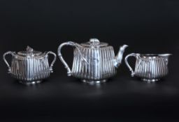 A FINE JAPANESE SILVER THREE PIECE TEA SERVICE, CIRCA 1890-1910, comprising teapot,