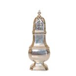 A GEORGE V SILVER SUGAR CASTER, Chester 1920, of faceted baluster form with urn finial. 16.5cm, 4.