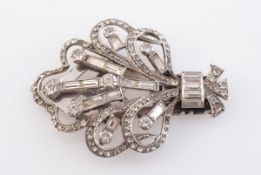 A SILVER LAPEL CLIP, the symmetrical scroll detail mount on heavy clip back. Stamped 935.
