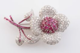A RUBY AND DIAMOND BROOCH, modelled as a flower,