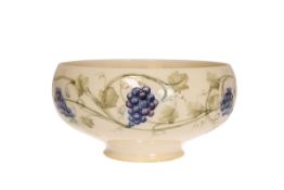 WILLIAM MOORCROFT FOR LIBERTY & CO A GRAPEVINE PATTERN BOWL, circular footed form,