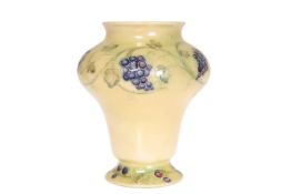 WILLIAM MOORCROFT FOR LIBERTY & CO A LUSTRE VASE IN THE GRAPEVINE PATTERN,