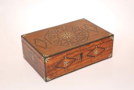 AN EARLY 19TH CENTURY BONE AND EBONY INLAID BOX, the inlay arranged geometrically.