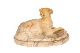 A SIENNA MARBLE MODEL OF A SEATED HOUND, 19th CENTURY, modelled seated on an integral oval plinth.