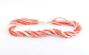 A CORAL AND SEED PEARL NECKLACE, of multi strands of graduating coral beads and seed pearls,