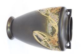 A ROSEVILLE POTTERY VASE, of ovoid form with small lug handles,