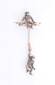 A LATE VICTORIAN PASTE SET BROOCH, realistically designed as two monkeys,