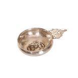 A LARGE CONTINENTAL WHITE METAL TASTE VIN, with pierced scroll handle,