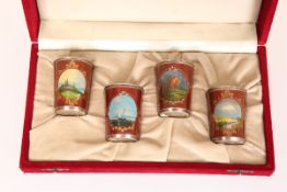 A SET OF FOUR RUSSIAN SILVER AND ENAMEL VODKA CUPS,