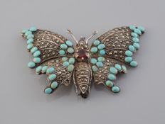 A MARCASITE AND TURQUOISE BROOCH, modelled as a butterfly,