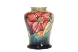 A WALTER MOORCROFT VASE IN THE CLEMATIS PATTERN, of shouldered ovoid form,