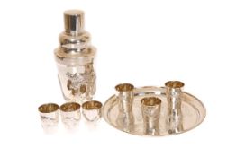 A CHINESE EXPORT SILVER COCKTAIL SET, comprising shaker, six tumblers and circular tray,