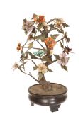 A CHINESE SPECIMEN HARDSTONE TREE JARDINIERE, possibly 19th century, realistically modelled,