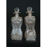 A PAIR OF LATE VICTORIAN SILVER-MOUNTED WRYTHEN GLASS DECANTERS, William Comyns & Sons Ltd,
