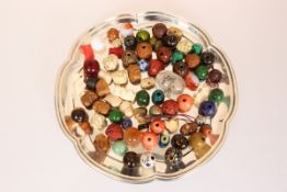 A CASE CONTAINING A COLLECTION OF JAPANESE OJIME BEADS, including coral, ivory, lacquer,