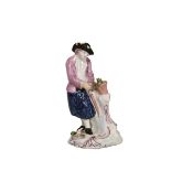 AN ENGLISH PORCELAIN FIGURE OF A GARDENER, 18th CENTURY, modelled wearing an apron,
