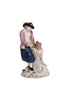 AN ENGLISH PORCELAIN FIGURE OF A GARDENER, 18th CENTURY, modelled wearing an apron,
