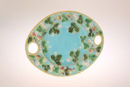 A GEORGE JONES MAJOLICA STRAWBERRY DISH, of oval form, painted and moulded with fruit and leaves,