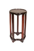 A CHINESE HARDWOOD STAND, the dished top of circular form,