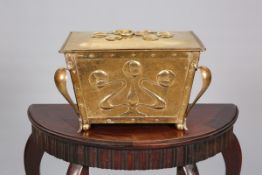 AN ARTS AND CRAFTS BRASS COAL BOX, of sarcophagus form with lift-off cover and scrolling legs,