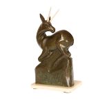 A FRENCH PATINATED BRONZE AND IVORY SCULPTURE OF AN ANTELOPE, c. 1930, signed E.