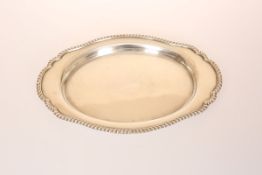 A SILVER STAND, Birmingham 1950, of oval form, with gadrooned rim. 23.5cm, 8.
