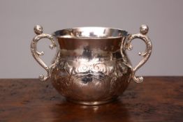 A CHARLES II SILVER TWO-HANDLED PORRINGER, HB conjoined, London 1664,