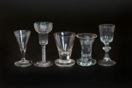 A GROUP OF FIVE 18th/19th CENTURY GLASSES, comprising: two firing glasses, one of trumpet form,