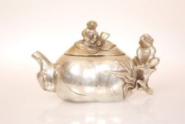 A CHINESE WHITE METAL TEAPOT, in the form of fruit with monkey-form handle and knop, seal mark.