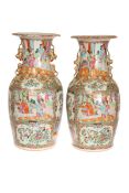A HANDSOME NEAR PAIR OF CHINESE CANTON VASES, 19th CENTURY, in the famille rose palette,