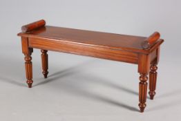 A MAHOGANY WINDOW SEAT IN 19TH CENTURY STYLE, with reeded legs.