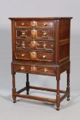 AN OAK MOULDED FRONT CHEST ON STAND, with moulded cornice above four long drawers,