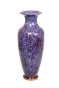 A CONTEMPORARY CHINESE EARTHENWARE VASE, of baluster form, with purple striated glaze,