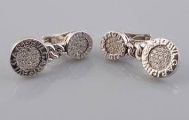 A PAIR OF DIAMOND EARRINGS BY BULGARI, from the Tubogas range, formed as two graduating discs,