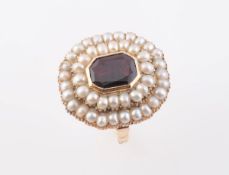 A LATE VICTORIAN GARNET AND PEARL RING,