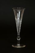TWO 19th CENTURY GLASS CHAMPAGNE FLUTES, the first of trumpet form,
