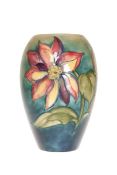 A WALTER MOORCROFT POTTERY VASE, of ovoid form,
