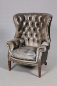 A HANDSOME LEATHER WING CHAIR IN GEORGIAN STYLE, with nicely worn deep buttoned leather,