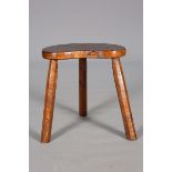 A FISHMAN OAK MILKING STOOL, CIRCA 1939,