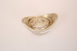 A CHINESE WHITE METAL TOKEN OR WEIGHT, of boat form,