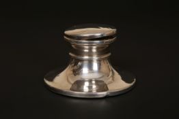 A SILVER INKWELL, Birmingham 1993, circular with hinged cover. 9.
