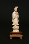 A PAIR OF CHINESE CARVED IVORY FIGURES, EARLY 20TH CENTURY, he stands holding a rui sceptre,