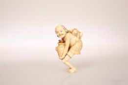 A JAPANESE IVORY NETSUKE, carved as a man with a child on his back holding a pot containing coral,