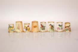 A COLLECTION OF EIGHT PORCELAIN THIMBLES, probably all Royal Worcester but only two marked,