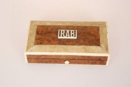 AN ASPREY FIGURED WALNUT, IVORY AND SHAGREEN SEWING BOX, the lid initialled RAB,