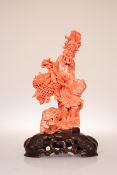 A FINE CHINESE CARVED CORAL FIGURE OF A FISHERMAN, 19th Century,