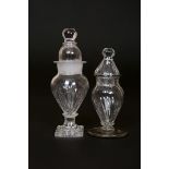 TWO ENGLISH GLASS DRY MUSTARDS, LATE 18th century, the taller with ball finial over a domed cover,